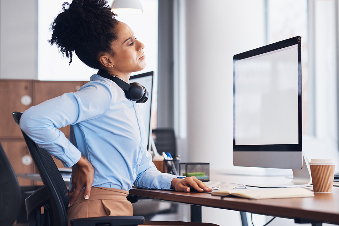 back-pain-call-center-and-business-black-woman-wi-2023-11-27-05-15-55-utc Female-Chiro-touching-lower-back-NF-Chiropractic