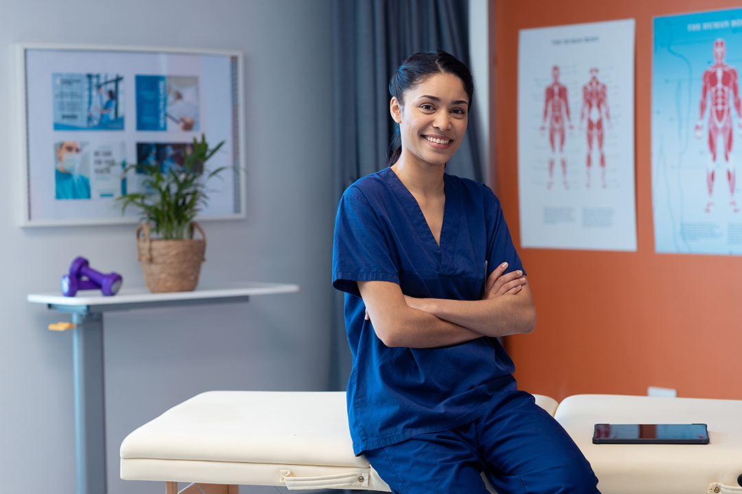 Group-of-Five-Chiropractors-Standing-and-Smiling-Together-NoFrills-Chiropractic-Singapore