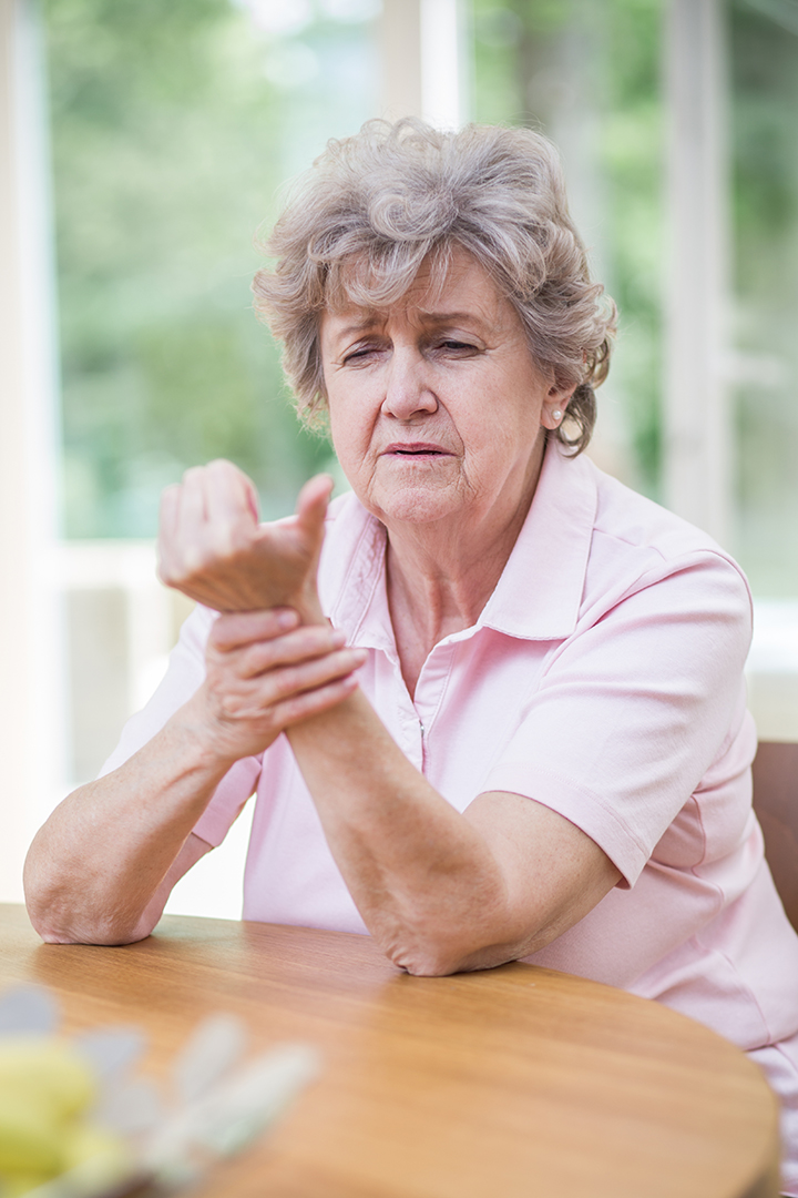 hands-2023asenior woman in pink t-shirt is holding her injured the wrist due to arthritis-11-27-05-05-13-utc senior woman in pink t-shirt is holding her injured the wrist due to arthritis